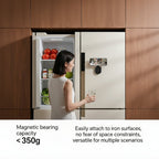 Woman standing in front of a refrigerator with a Maglock Suction Bracket 360 Degree Rotating Phone Holder attached.